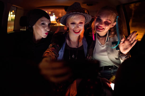 istock Taking selfies while driving to a Halloween party 1280159083
