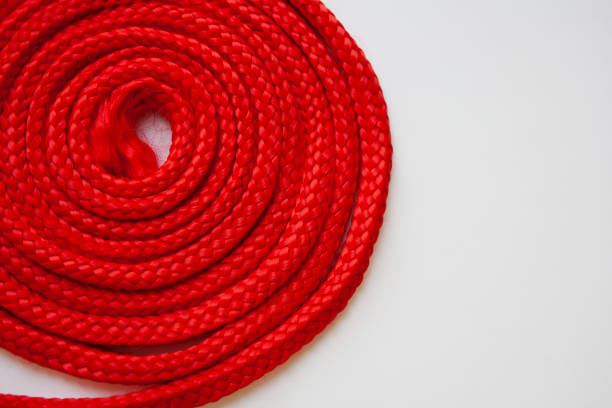 istock Red textured cable roll detail on white background 1280159894