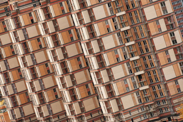 Multi-storey residential buildings under construction on a cloudy day