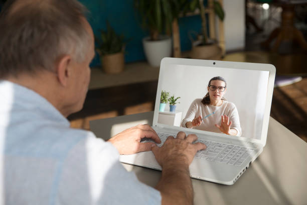 istock Elderly man watching an online video on laptop at home. Distancing. copy space. 1280161613
