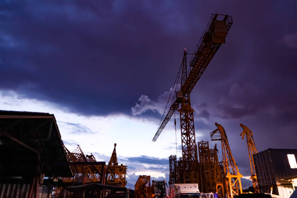 istock The tower crane in the west is about to set. 1280161810