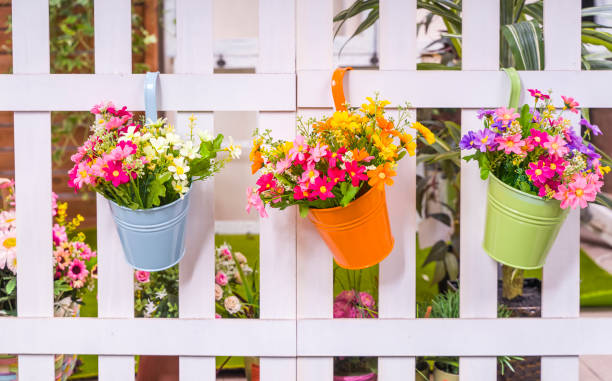 istock Hanging Flower Pots with fence 1280161859