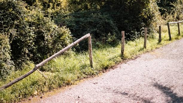 istock A broken wooden fence next to a dirt road (Gubbio, Umbria, Italy, Europe) 1280162373