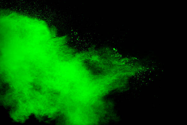 istock Abstract green dust explosion on black background. Abstract green powder splattered on background. 1280167718