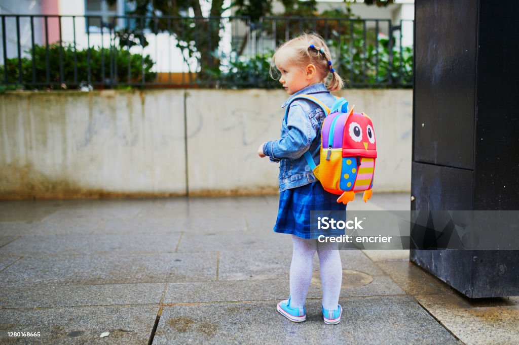 Adorable Toddler Girl With Funny Backpack Ready To Go To Daycare