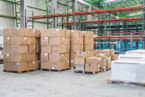 istock interior of warehouse. Rows of shelves with boxes 1280168723