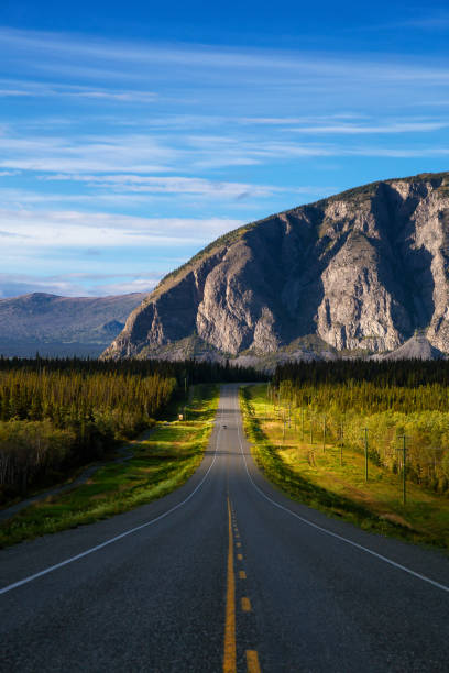 istock Scenic Route, Alaska Hwy, during a sunny and cloudy sunset. 1280169068