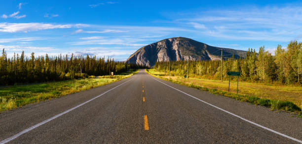 istock Scenic Route, Alaska Hwy, during a sunny and cloudy sunset. 1280169137