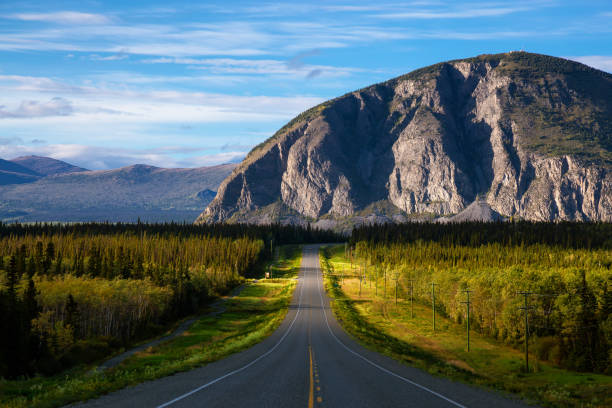 istock Scenic Route, Alaska Hwy, during a sunny and cloudy sunset. 1280169147