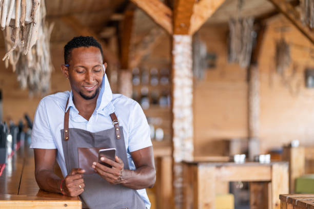 istock Bartender wears protective face mask and making teleconferencing, during COVID-19 1280169225