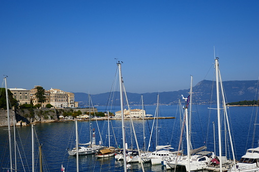 Moored yachts at the Corfu Old Fortress Harbour areas on a sunny day