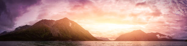 Beautiful Panoramic View of Canadian Nature with Mountains in the Background. Cloudy Sunset. Kathleen Lake, Kluane National Park, Yukon, Canada.