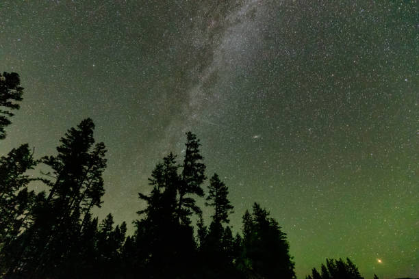 istock Milky Way, Stars and Aurora Lights Glowing during a Night Sky. 1280171777