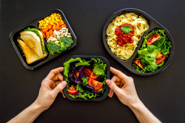 istock Food delivery background. Take away meal in boxes. Top view 1280173695