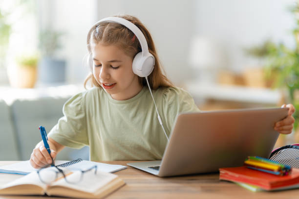 istock Girl doing homework or online education. 1280174818