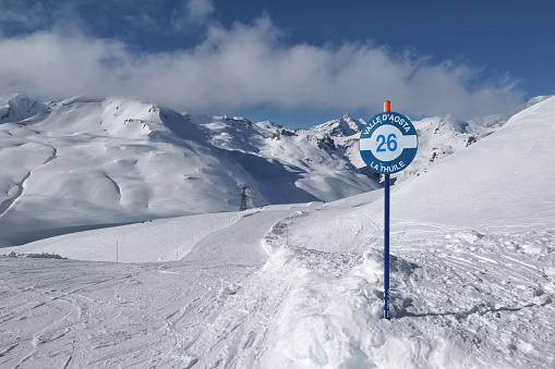 Scenic ski slope view in La Thuile, Aosta Valley in Italy. Italian Alps in winter.