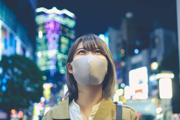 istock Asian woman wearing Protective Face Mask 1280175861