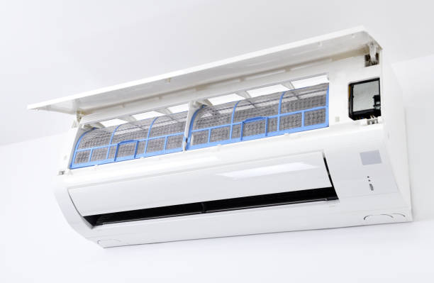 istock Air conditioner system on white wall room. Air conditioning.A white air conditioner is installed on a white wall in the apartment. 1280176275