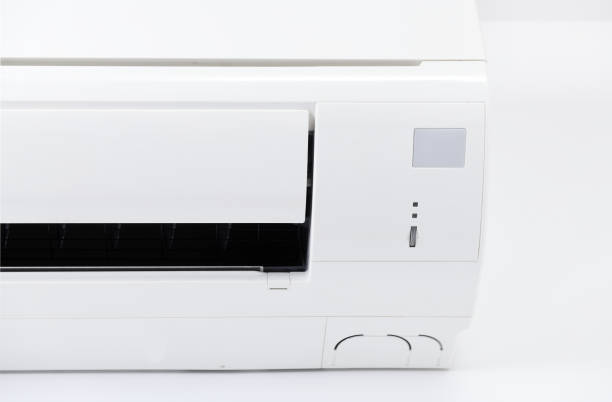 istock Air conditioner system on white wall room. Air conditioning.A white air conditioner is installed on a white wall in the apartment. 1280176506