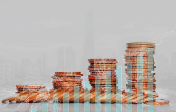istock double exposure of city with row of coin stack with growth chart and graph progress report for business investment finance banking and money saving concept. 1280178870