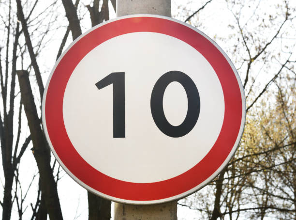 istock A speed limit sign of 10 km / h is installed on a concrete pillar. 1280178942