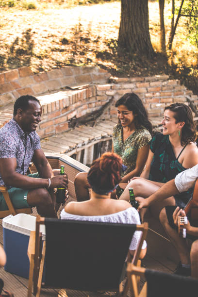 istock Friends enjoying beer and laughing while on a picnic 1280180931