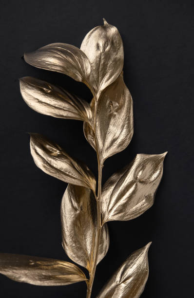 istock Golden painted leafs on black background. Minimal concept for wedding banner, invitation card template. 1280181734