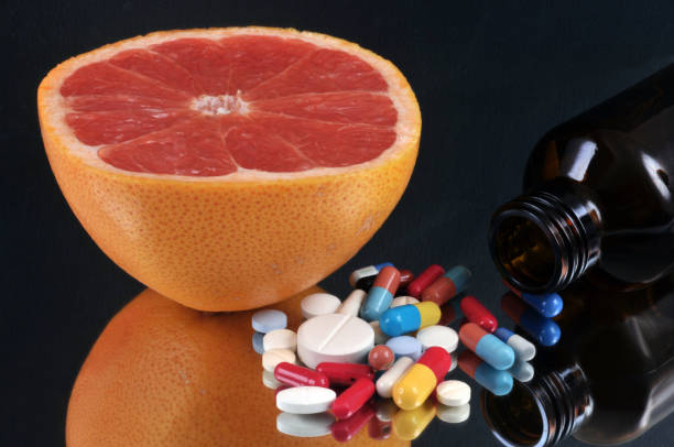 istock Flask of medicines and grapefruit 1280183230