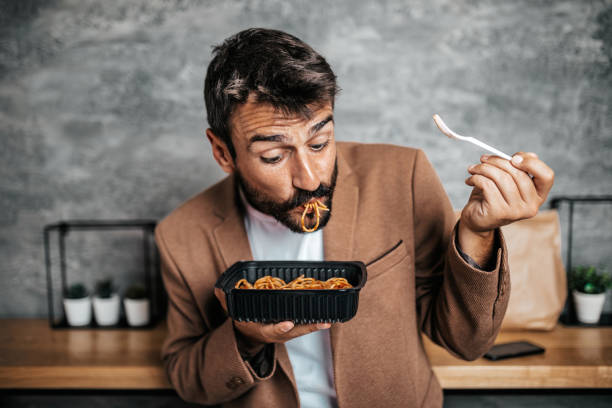 istock Business man at fast food restaurantt 1280184272