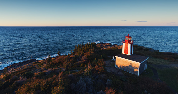 Drone view of Point Prim Lighthouse on Nova Scotia's Bay of Fundy coast.