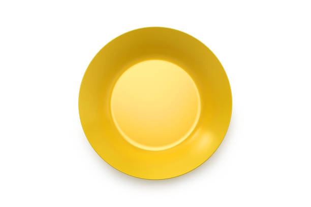 istock Yellow dish plate isolated on white, Empty porcelain tableware for food and cutlery set, Mock up of round ceramics kitchen utensils collection. 1280185673