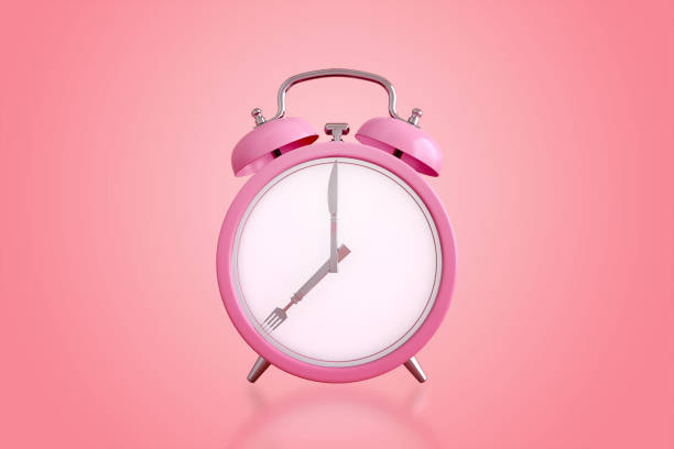 istock Alarm clock with cutesy, Concept for intermittent fasting diet, meal time or appointment schedule. 3d rendering 1280185676