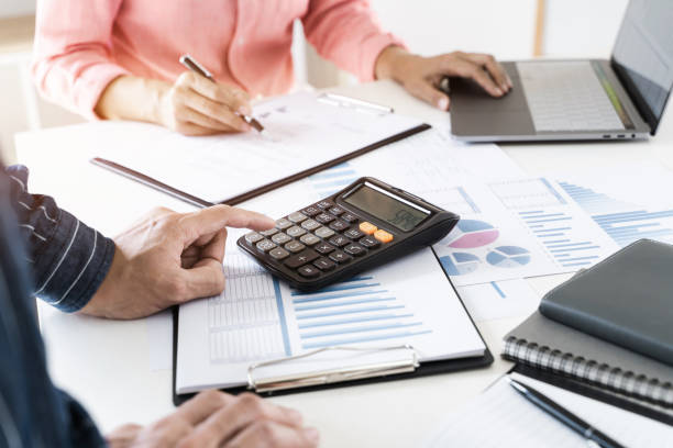 Accountant team working with valuation report. stock photo
