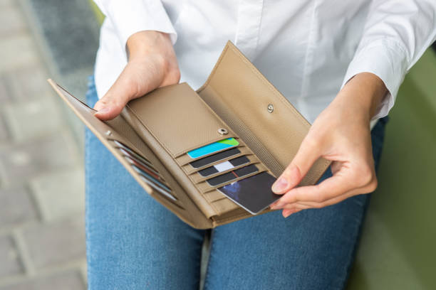 istock A girl holding an open wallet in her hand 1280188148