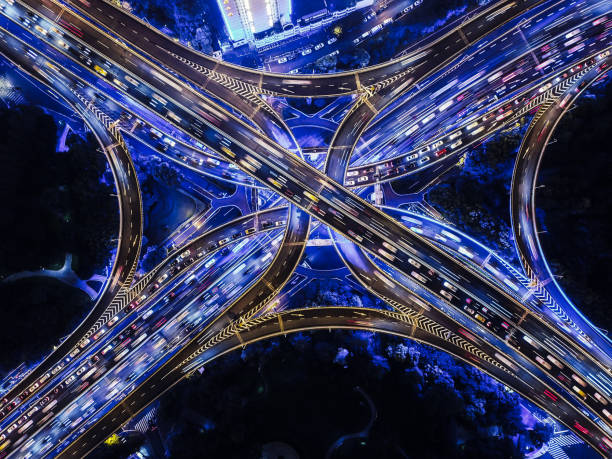 istock Drone Point View of Overpass and City Traffic at Night 1280189543