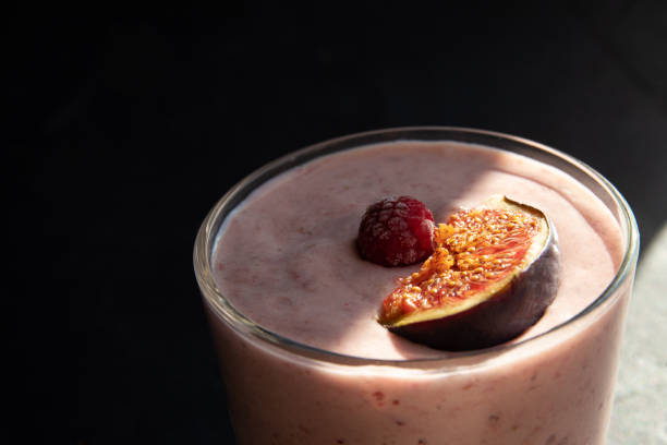 istock Yogurt with figs, raspberries in a glass. Quick breakfast. 1280190119