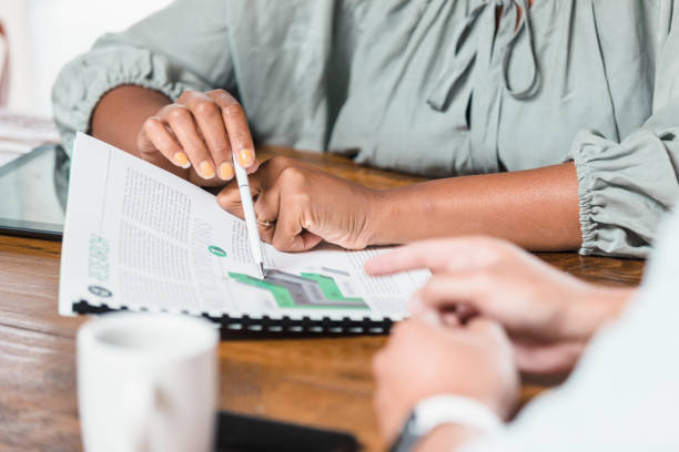istock Unrecognizable colleagues discuss graphs in marketing report 1280190352