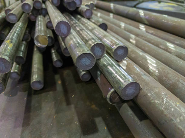 istock raw stainless steel rods storage - closeup with selective focus and background blur 1280190759