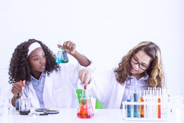 istock Two girls studying science in classroom at school 1280192135