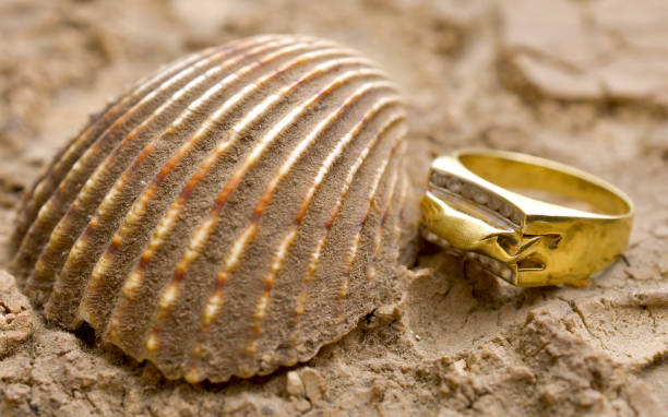 istock image of cheap used ring bijouterie on sea shell 1280192535