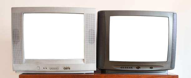 istock Two outdated vintage TVs with blank white screens sit on a vintage table in a 1990s apartment block. 1280193734