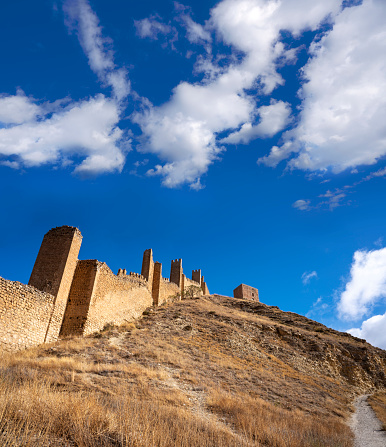 Hail city downtown and walls of Arabian Aarif fortress standing on the hill, Hail, Saudi Arabia