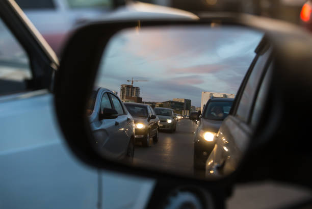 istock Car traffic in a car mirror 1280198349