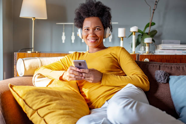 istock Mature woman with smart phone at home 1280198562