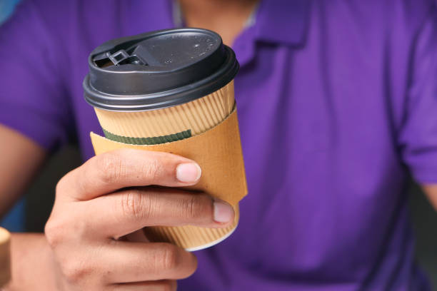 istock hand holding reusable eco coffee cup close up 1280200892