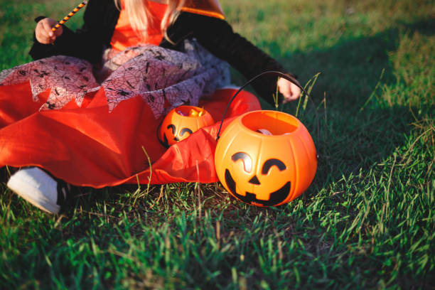 istock halloween candy baskets lie on the grass 1280201206