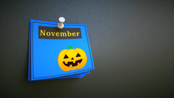 A stack of colorful blue notes with the label November and a Jack-o-Lantern pumpkin icon. Suitable  for additional composition.