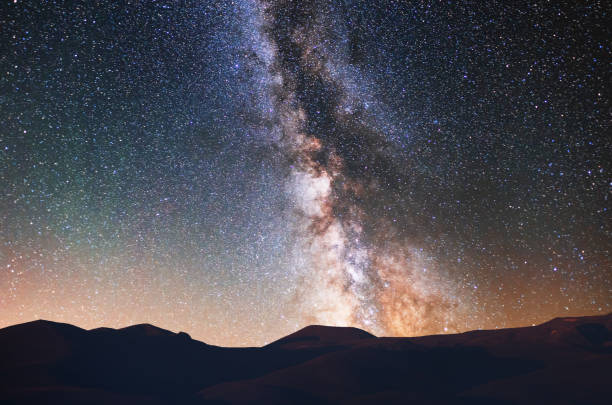 istock Beautiful bright milky way galaxy over the mountains. 1280203276