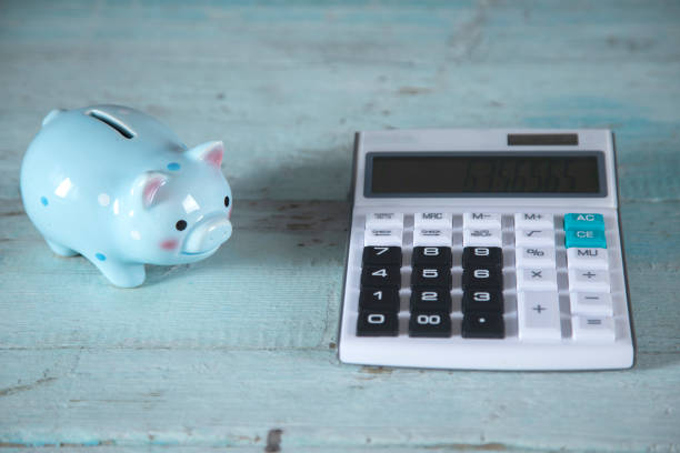 istock piggy bank and calculator 1280203891