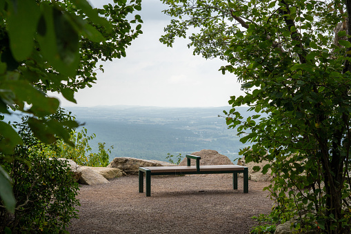 A bench at the rocky outcrop at the Hawk Mountain sanctuary overlook in Pennsylvania.